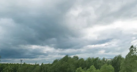 Storm Clouds Moving in Time Lapse and cell tower on background after Summer Rain Stock Footage 209567537