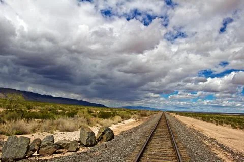 Storm Clouds Moving towards Train Tracks Stock Photos