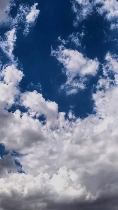 Storm clouds open to reveal patches of blue sky in time lapse, dramatic weather Stock Footage 340190530