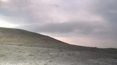 Storm Clouds Over Barren Landscape Stock Footage 12059809