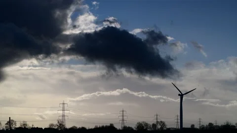 Storm clouds over electricity generating windmills near drax yorkshire uk Stock Footage 220276699