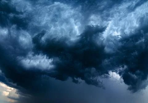 Storm clouds over field, tornadic supercell, extreme weather, dangerous storm Stock Photos