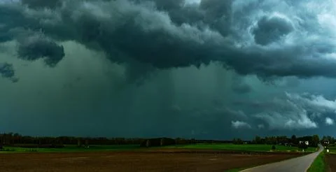 Storm clouds over field, tornadic supercell, extreme weather, dangerous sto.. Stock Photos