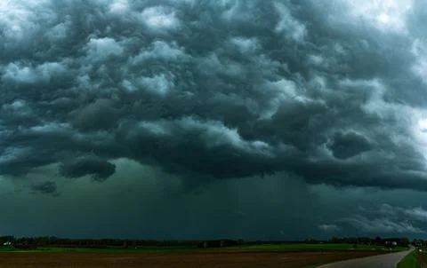 Storm clouds over field, tornadic supercell, extreme weather, dangerous sto.. Stock Photos