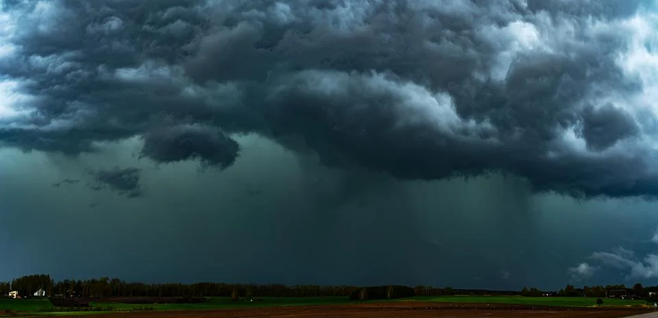 Storm clouds over field, tornadic supercell, extreme weather, dangerous sto.. Stock Photos
