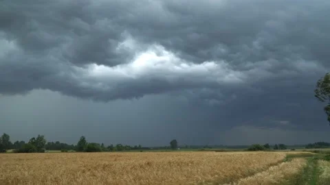 Storm clouds over a flat field. time lapse Stock Footage 134947635