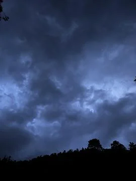 Storm clouds over the forest Stock Photos