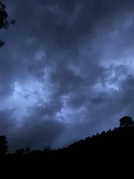 Storm clouds over the forest Stock Photos