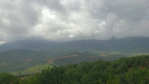 Storm clouds over green mountains Stock Footage 79445017
