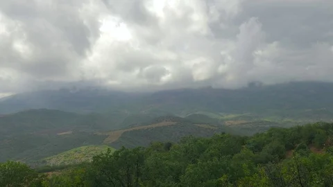 Storm clouds over green mountains, time lapse Stock Footage 79445157