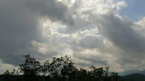 Storm clouds over green mountains Stock Footage 79445735