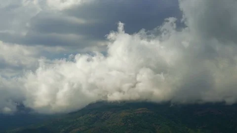 Storm clouds over green mountains Stock Footage 79448729
