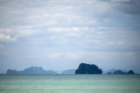 Storm clouds over limestone islands at Tubkaek Beach Stock Photos