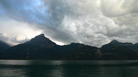 Storm clouds over the mountains and Lake. Video stock 65210646