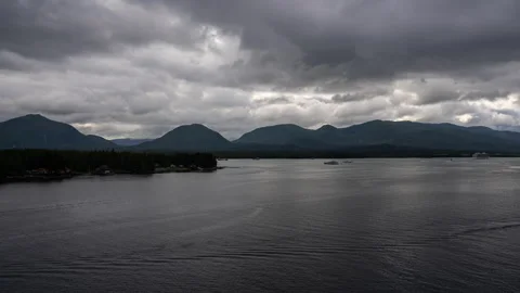 Storm clouds over mountains and a calm channel in Alaska timelapse Stock-Footage 347818792