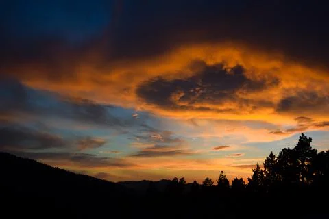 Storm Clouds Over The Mountains During Sunset Fotos de archivo