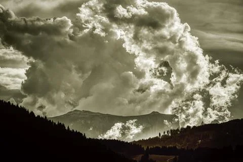 Storm clouds over the mountains Stock Photos