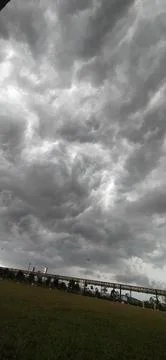 Storm clouds over open landscape with dramatic sky 스톡 사진