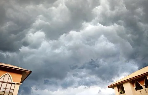 Storm Clouds Over Orange?Tiled Rooftops Stock Photos