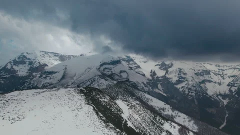Storm clouds over the peaks with a 4K drone Video stock 240588453