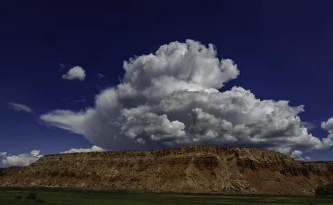 Storm Clouds over red rock mesa Stock Photos