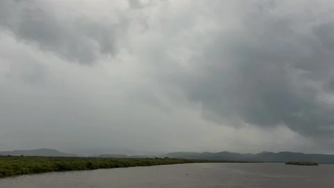 Storm Clouds over River Landscape Video stock 337928911