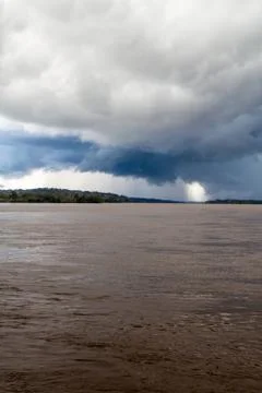 Storm clouds over river Napo, Ecuador Stock Photos