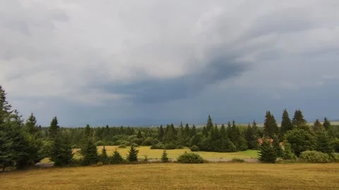 Storm clouds over a scenic forest and valley  Stock Footage 315017050