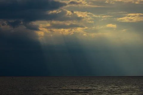 Storm clouds over the sea. Seashore with rain clouds Stock Photos