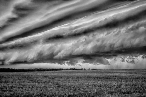 Storm clouds over the sloping field Foto stock