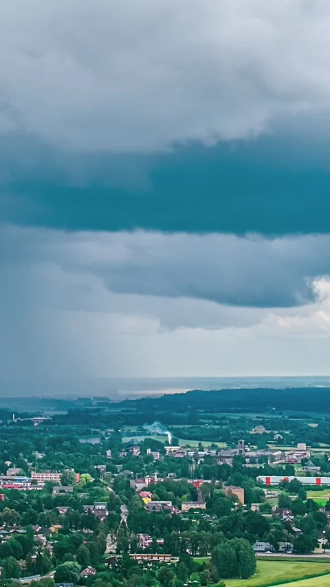 Storm Clouds Over Small Town and Countryside 스톡 동영상 331106075