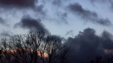 Storm clouds over the sun, tree, timelapse Stock Footage 196963459