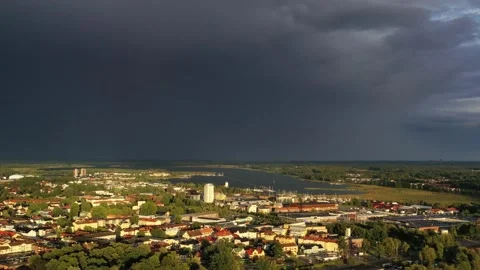 Storm clouds over a Swedish city filmed with drones high from above. Stock Footage 161109063