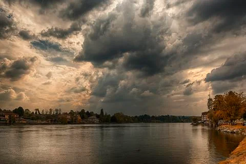 Storm clouds over the Ticino river Stock Photos