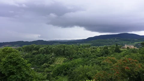 Storm Clouds Over Tuscan Greenery Stock Footage 247275120