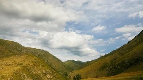 Storm clouds ower the mountain valley Stock Footage 165329954