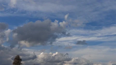 Storm clouds pass over a wooded hill in autumn Stock Footage 63302921