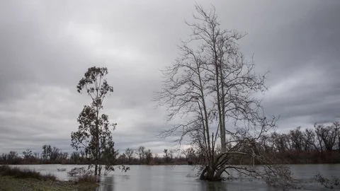 Storm Clouds Passing Over A Rising River Time Lapse Stock Footage 72194786