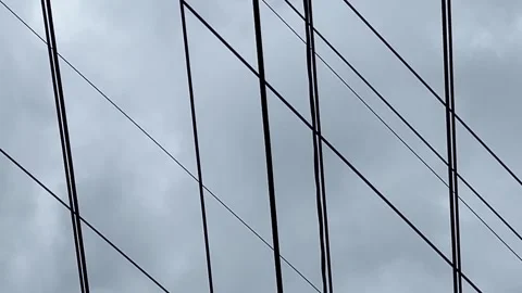 Storm clouds passing quickly through the sky behind high power lines Stock Footage 285991784