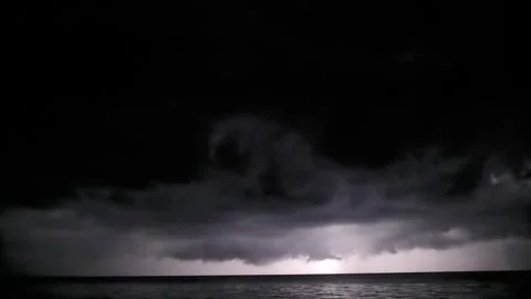 Storm clouds rain and lightning above the sea Vídeo Stock 328319198