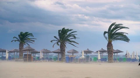 Storm clouds, rain and wind bring dangerous weather conditions to Beach Stock Footage 117816036