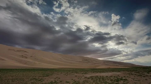 Storm clouds before rain in the Gobi Desert, dune Hongoryn, Mongolia.  Stock Footage 77154123