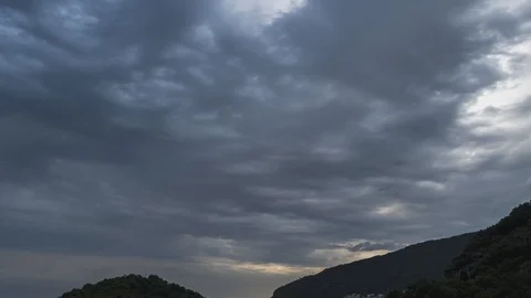 Storm clouds with rain over mountain and forest, strong wind. Video stock 129510457