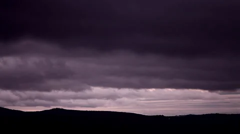 Storm clouds roll by at dusk Stock Footage 51353378