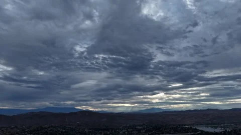 Storm Clouds Rolling Over California Valley in Timelapse with Mountain Backdrop Video stock 345861852