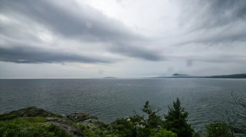 Storm clouds rolling in over lake Stock Footage 40431661