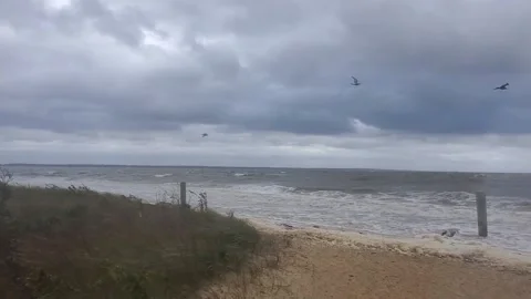 Storm clouds rolling in over the Raritan Bay in New Jersey 動画素材 166006499