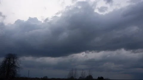 Storm clouds rush over the trees. Timelapse Stock Footage 152923841