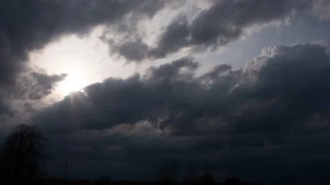 Storm clouds rush over the trees, lightning flashes. Timelapse Stock-Footage 152924045