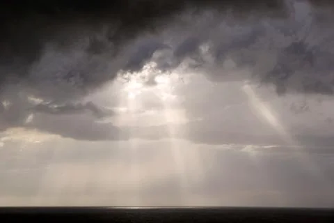 Storm clouds on the sea Stock Photos